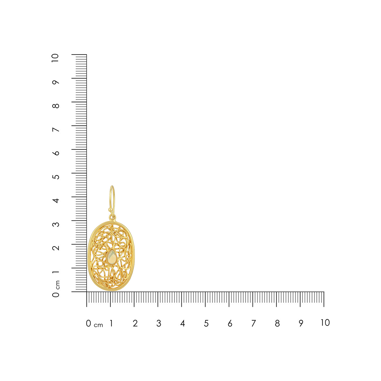 Gold pendant with intricate design next to a ruler on a white background