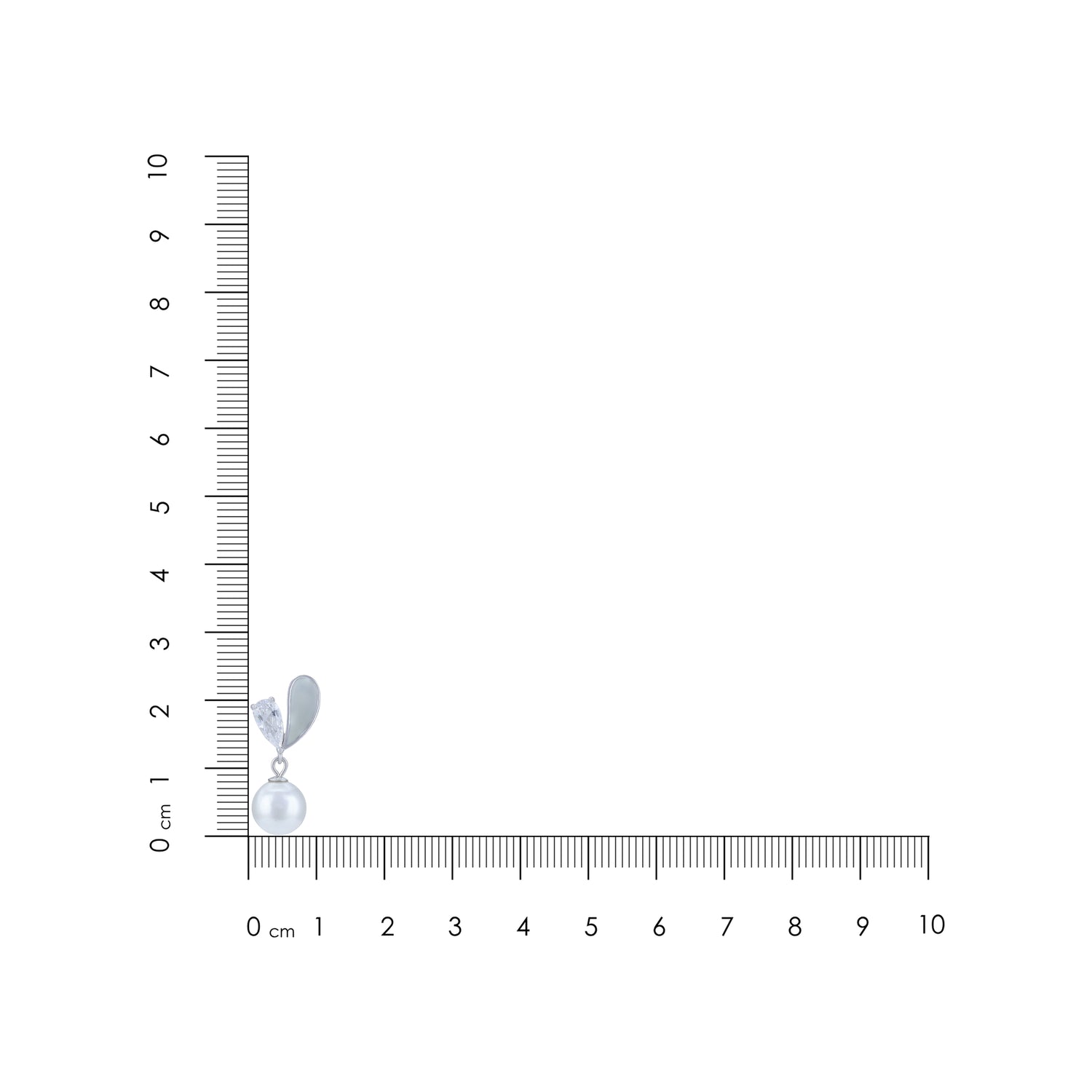 Dangle earrings with a pearl on a ruler for scale