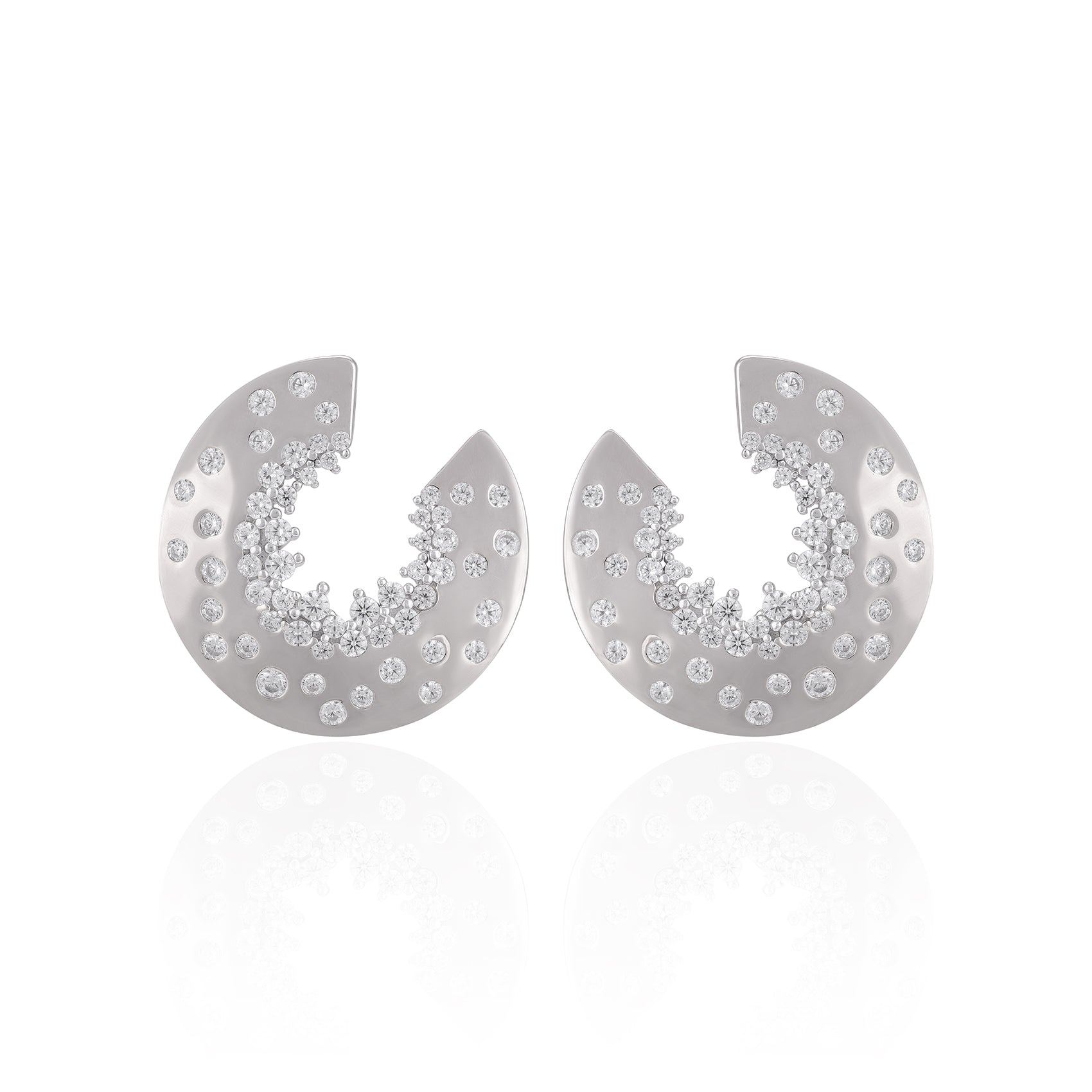 Silver earrings with gemstone accents on a white background