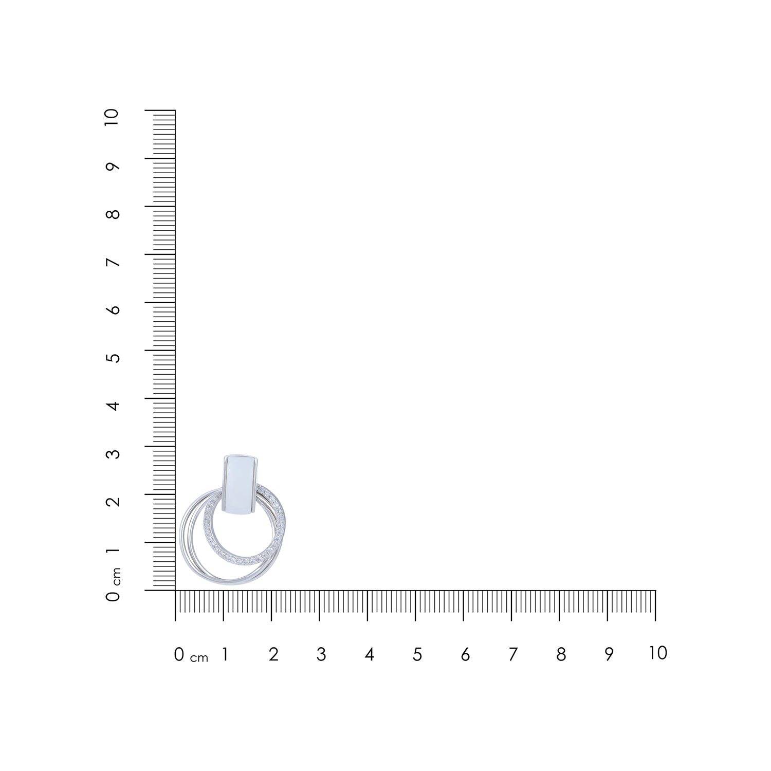 Silver ring with a circular design on a white background with a ruler for scale.