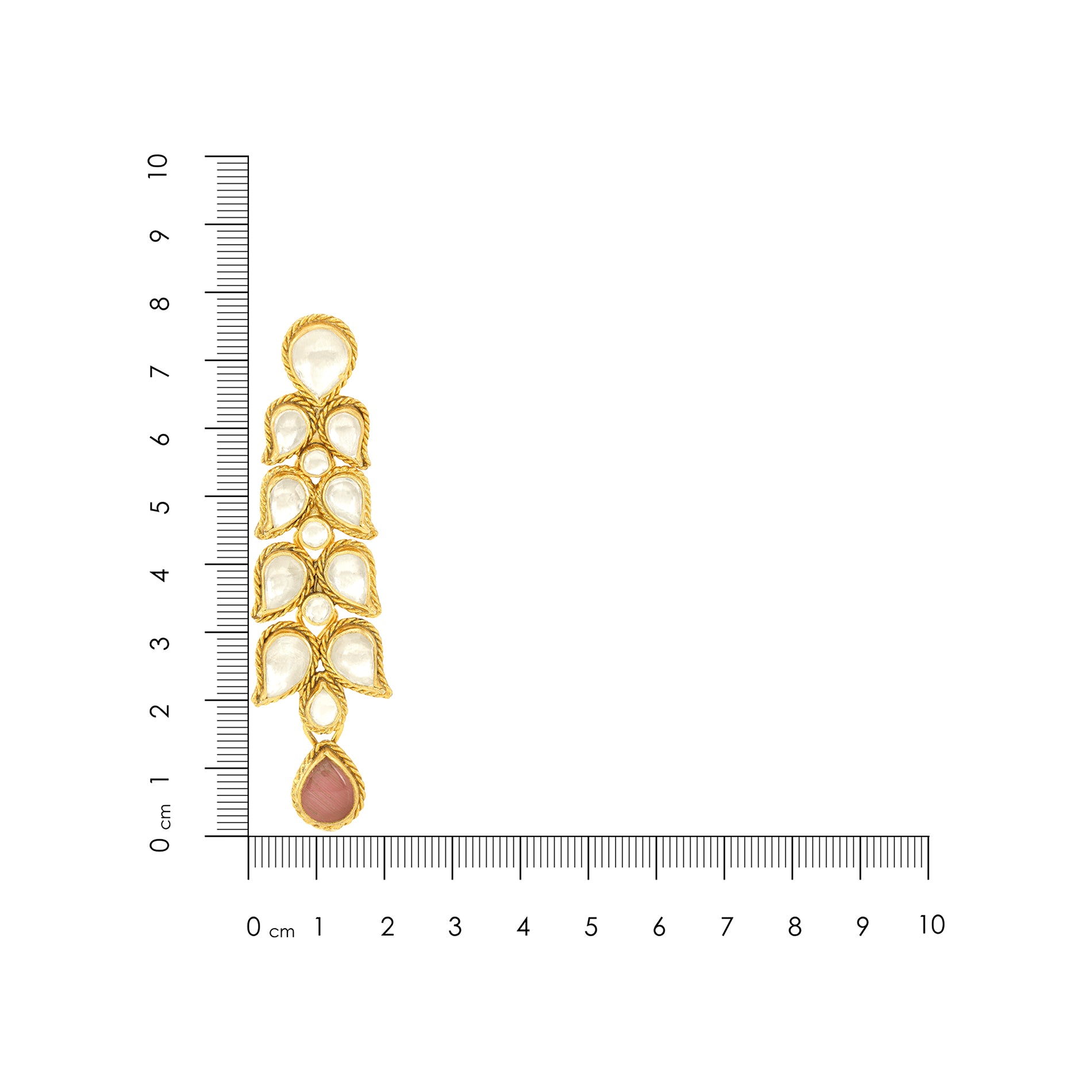 Gold and pearl earring with a ruler for scale on a white background