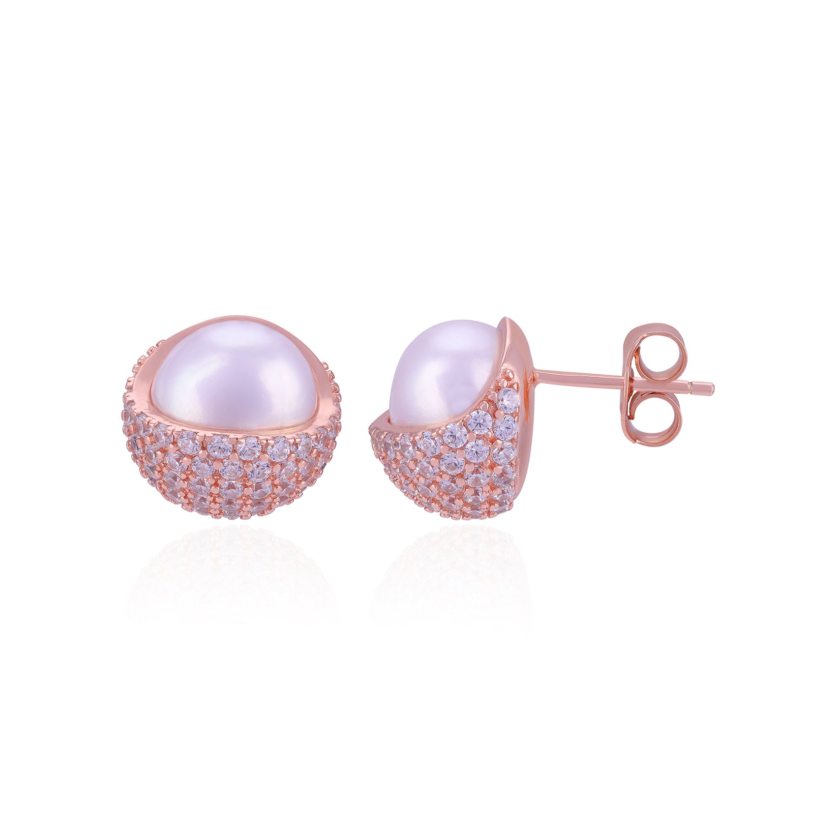Pair of pearl earrings with rose gold and clear gemstone accents on a white background