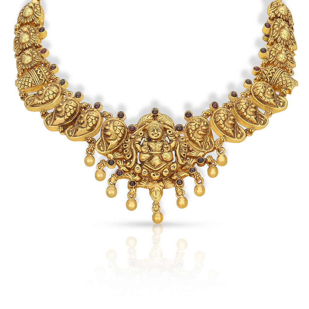 Gold necklace with intricate designs on a white background