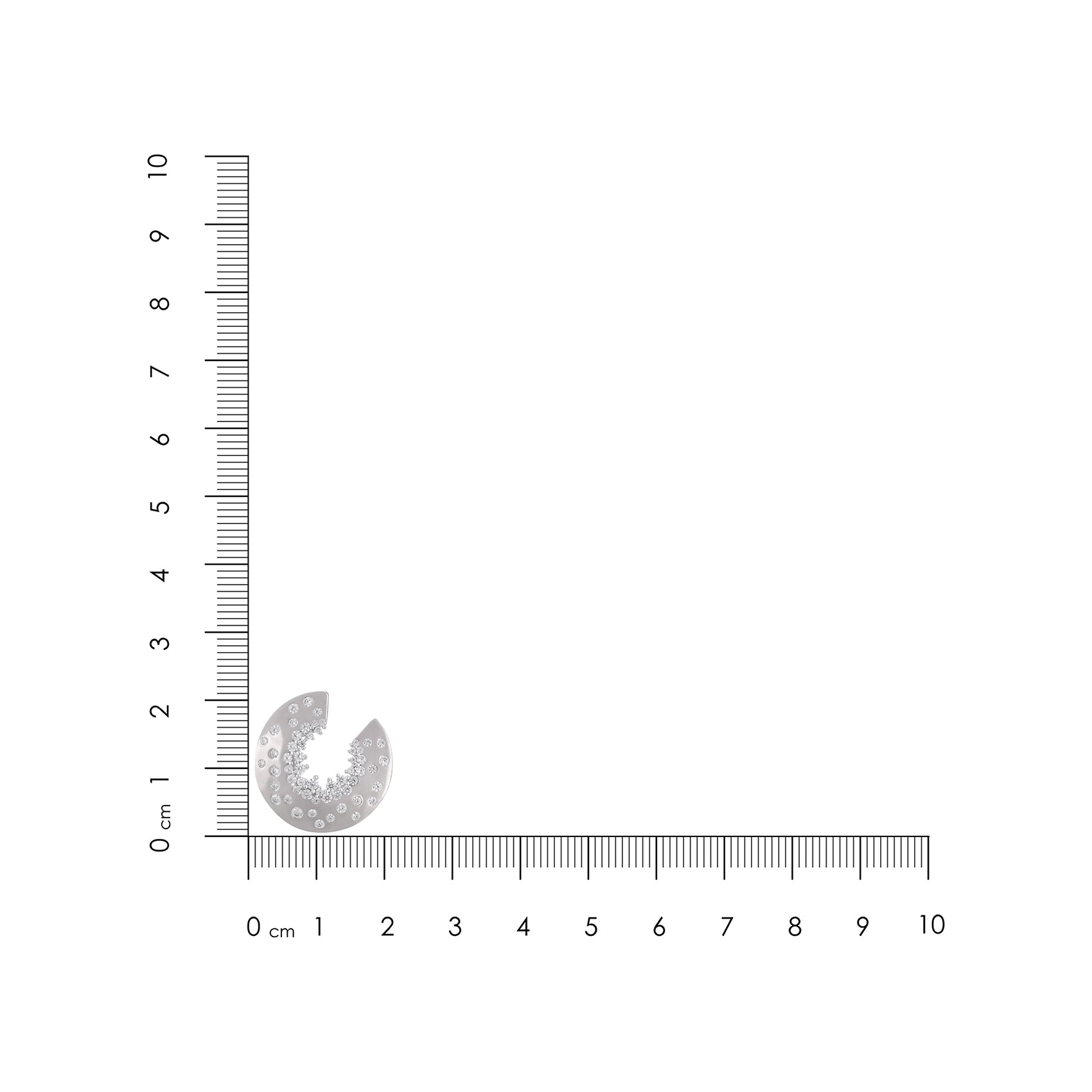 Small circular object next to a ruler on a white background