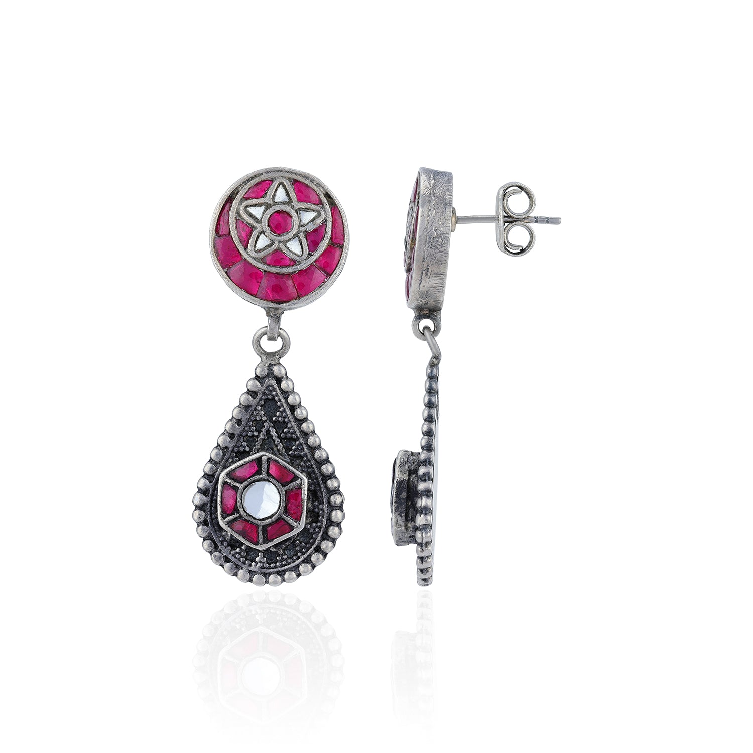 Silver earrings with pink and black gemstones on a white background