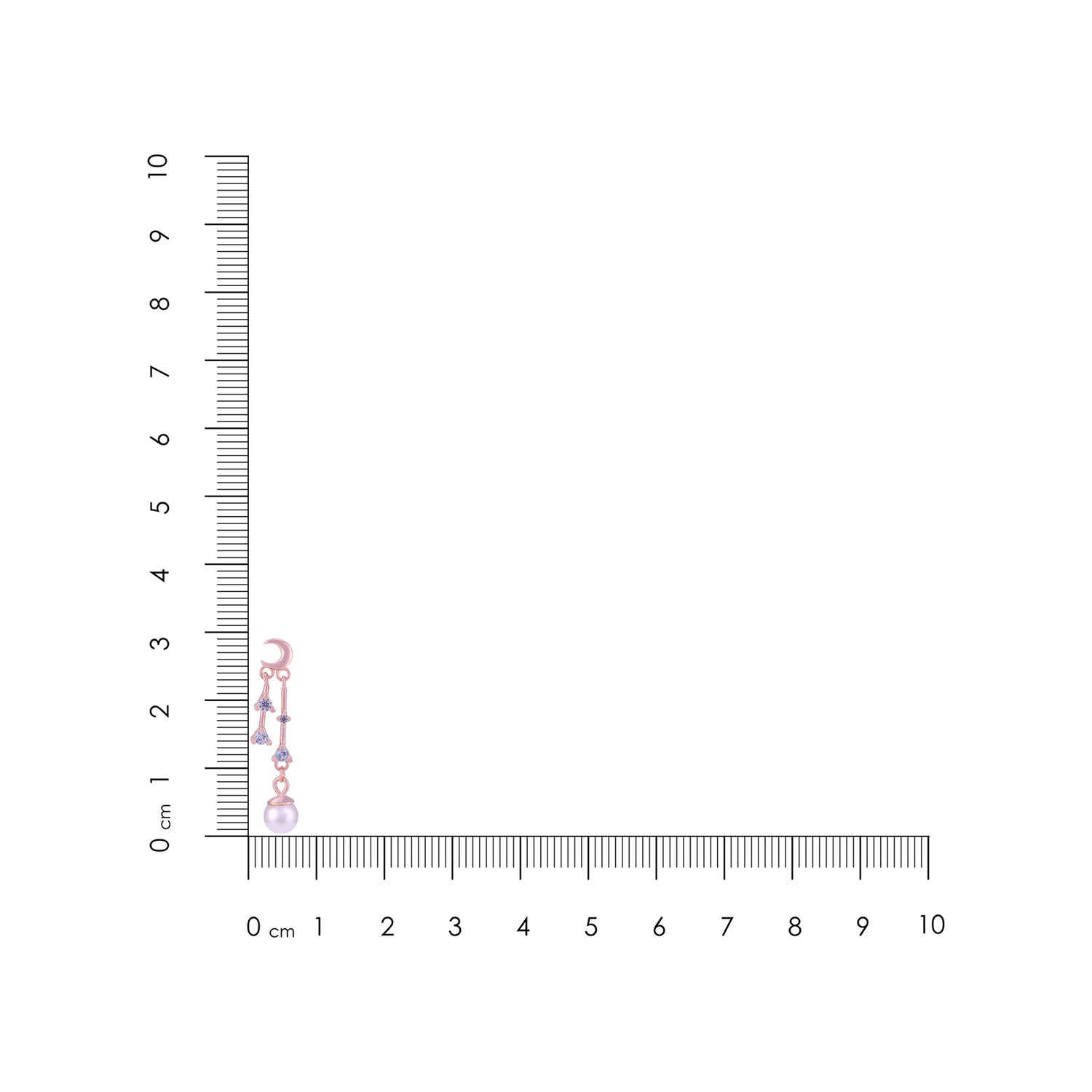 Small pink flower arrangement next to a ruler for scale on a white background