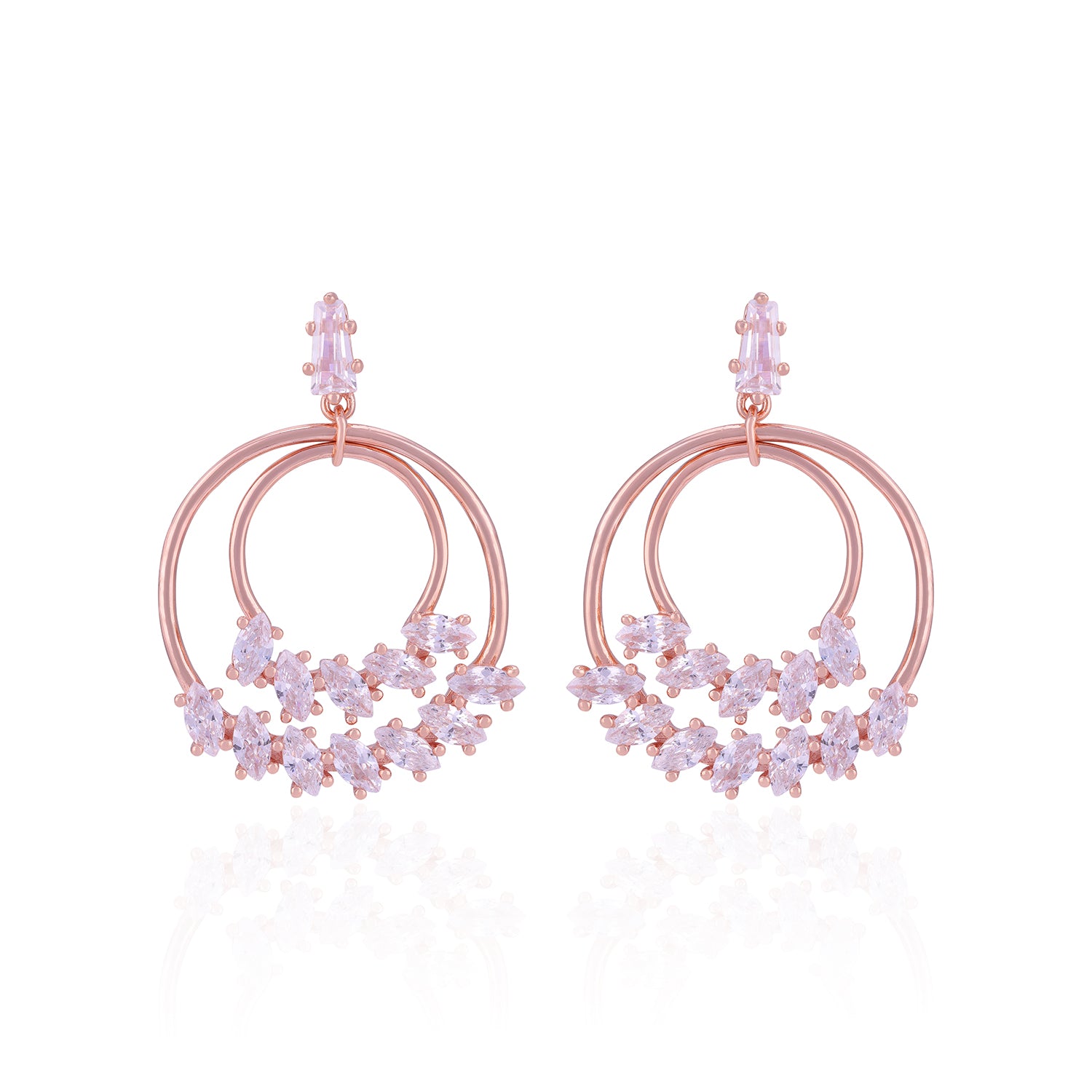 Rose gold hoop earrings with floral designs on a white background