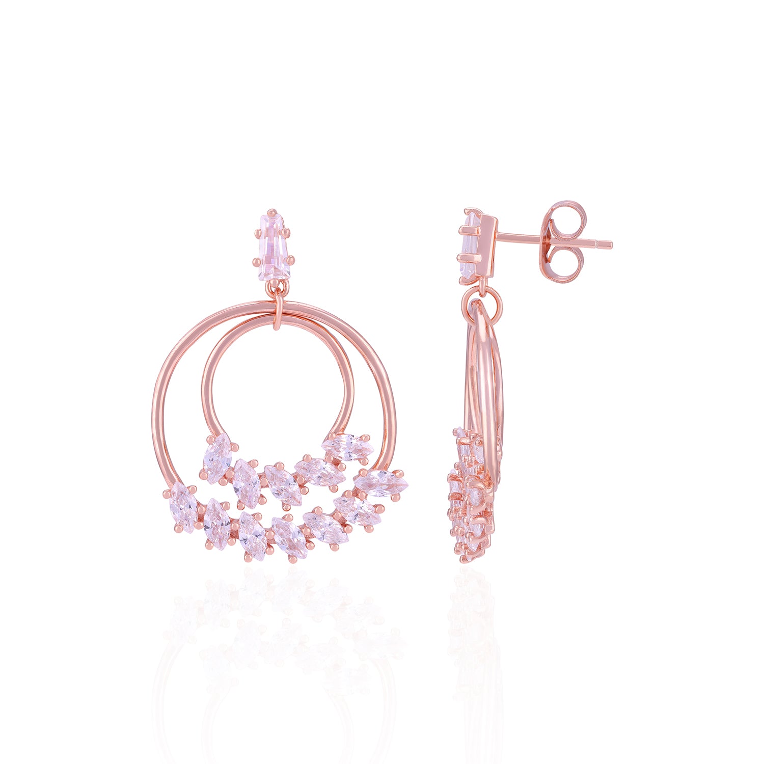 Rose gold earrings with pink gemstones on a white background