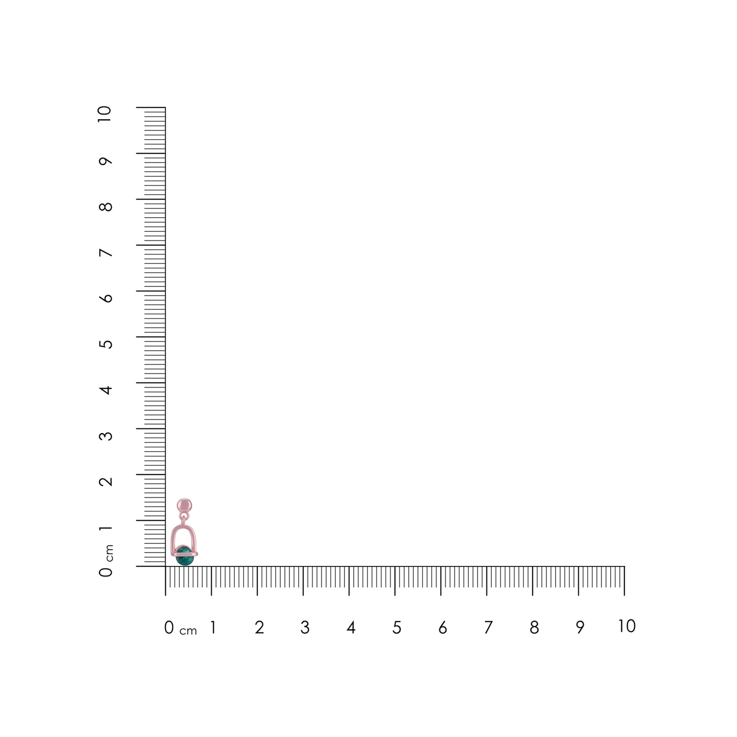 Small pink and green object next to a ruler on a white background