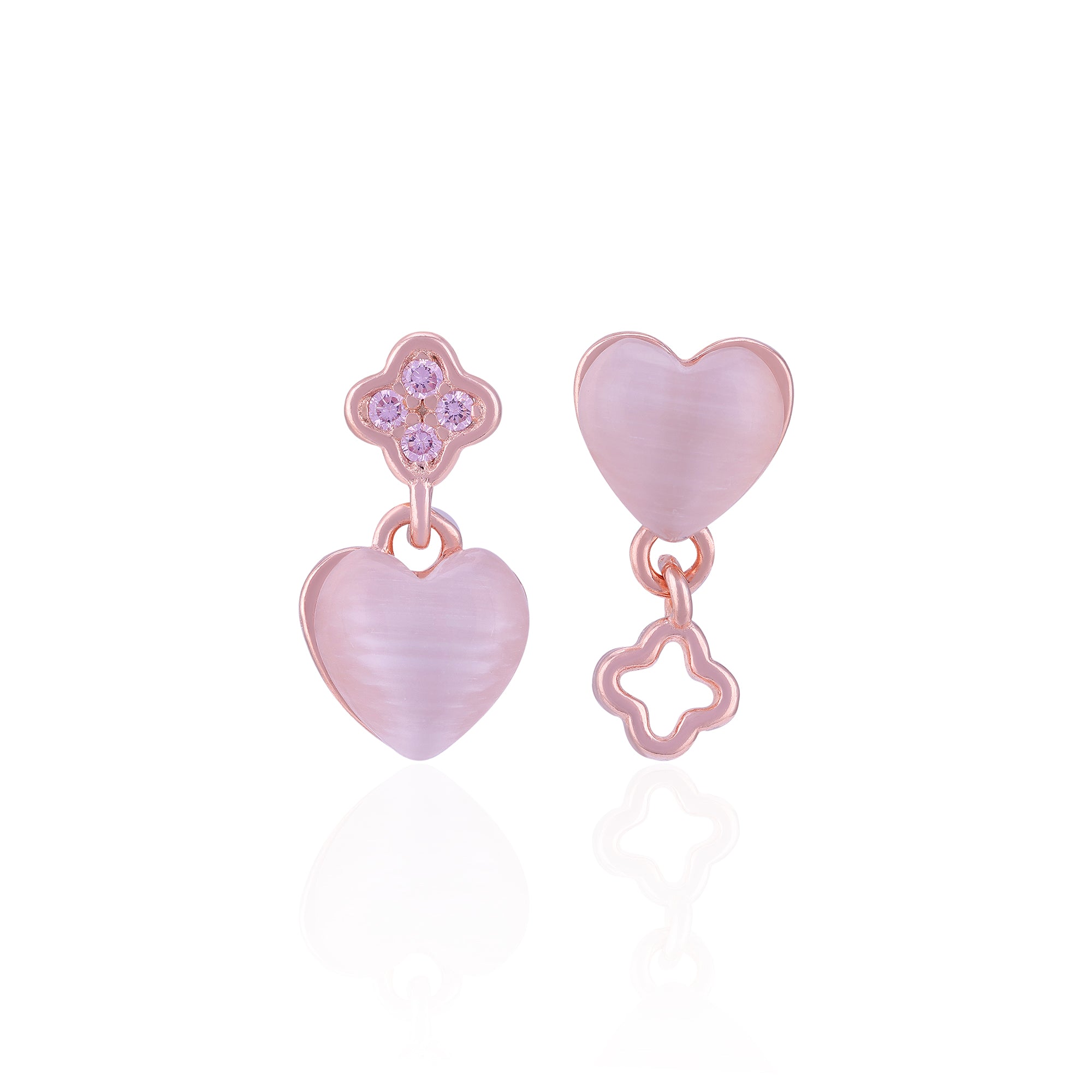 Pair of pink heart-shaped earrings with star details on a white background