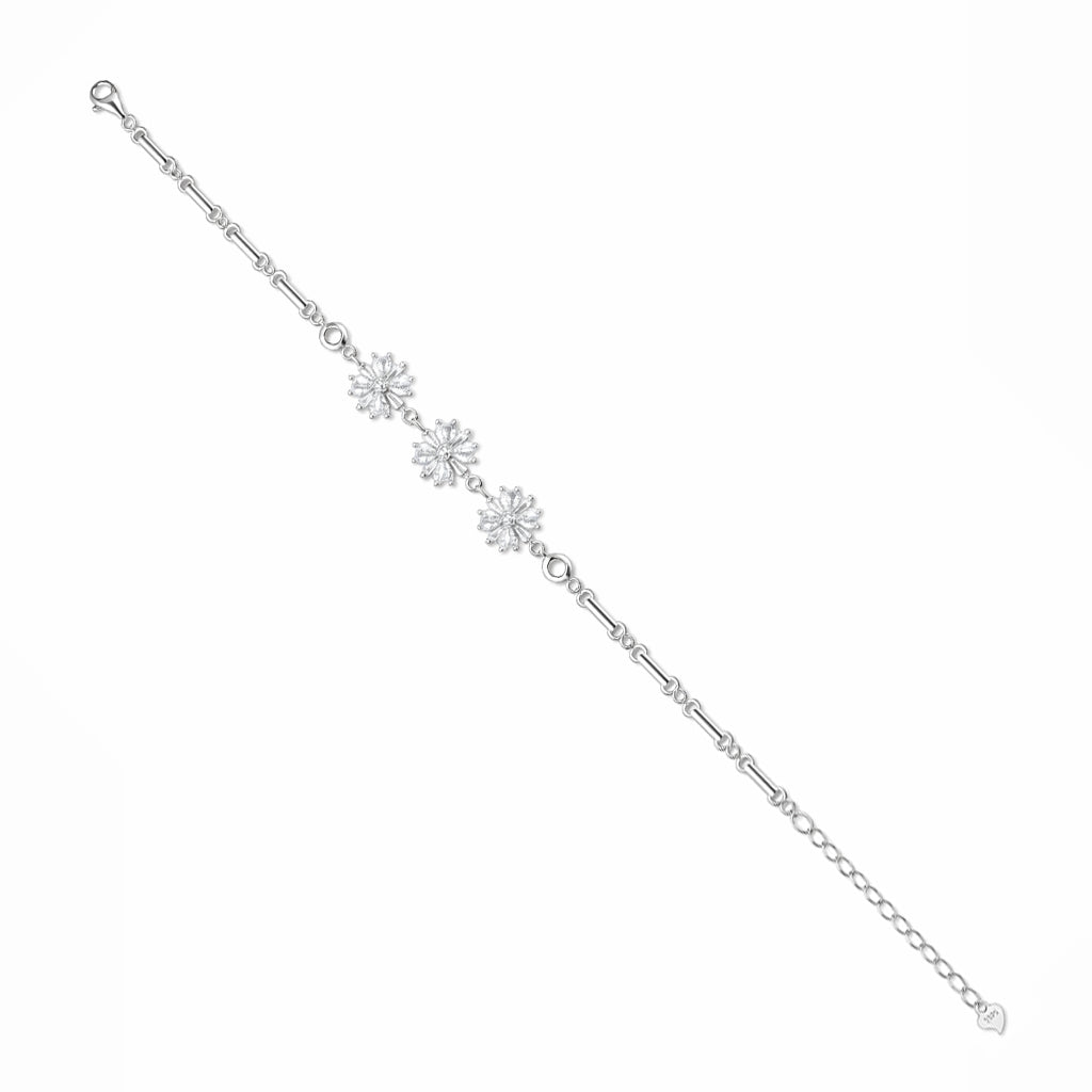 Silver bracelet with floral charms on a white background