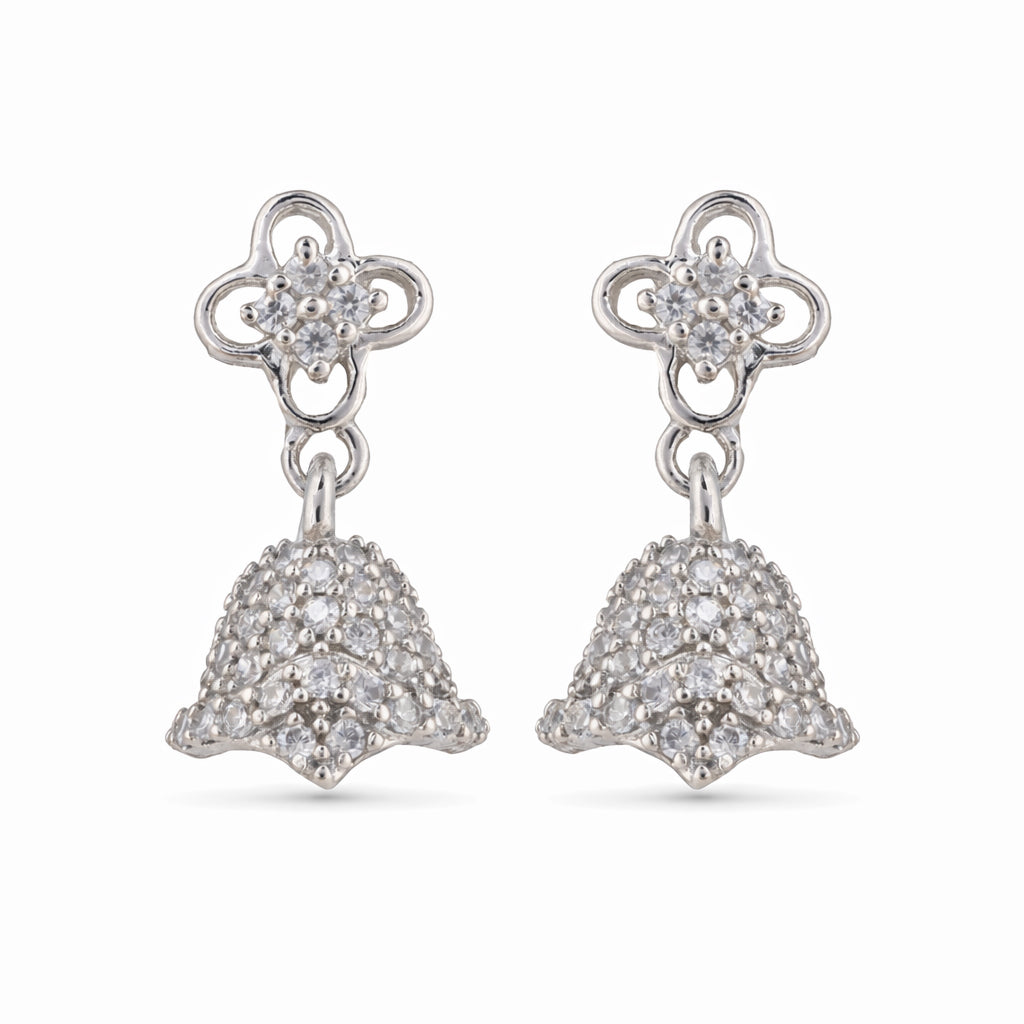 Silver earrings with floral top and bell-shaped bottom on a white background