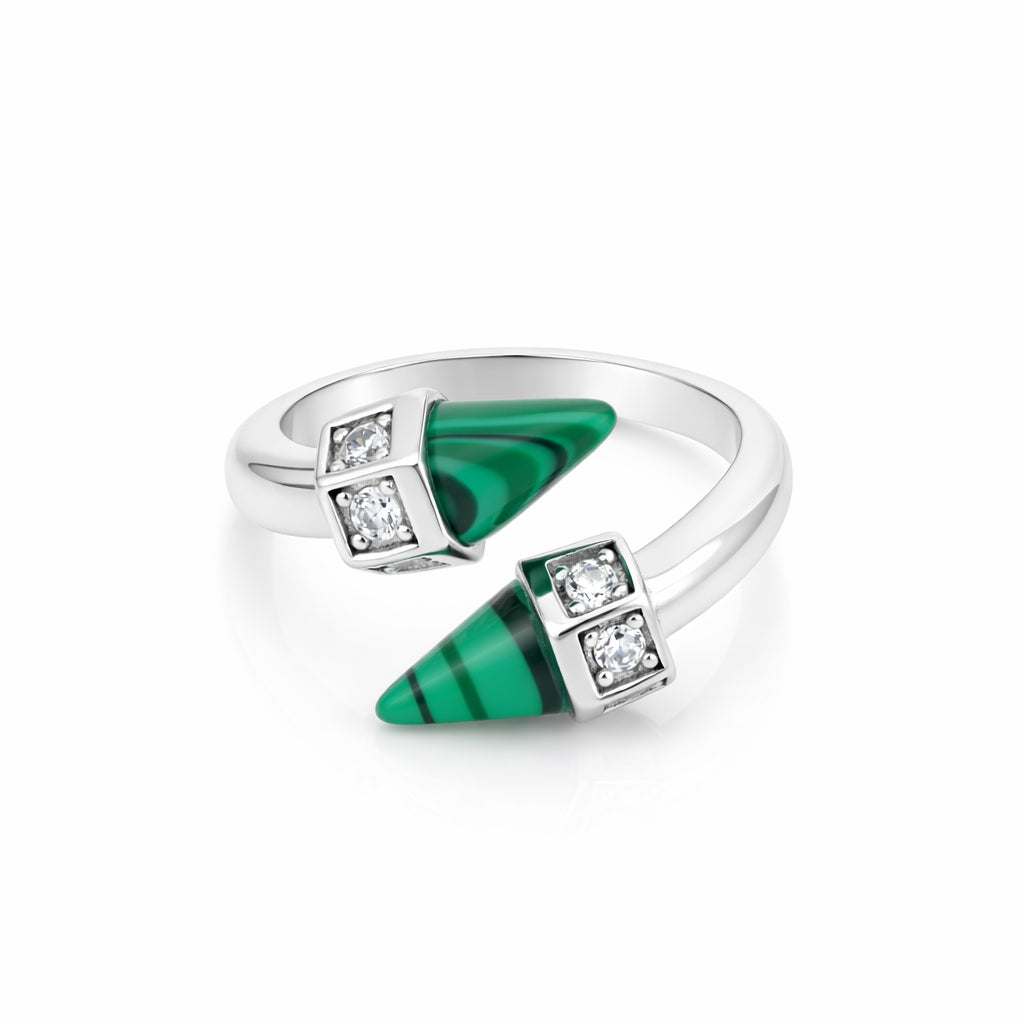 Silver ring with green gemstones and diamonds on a white background