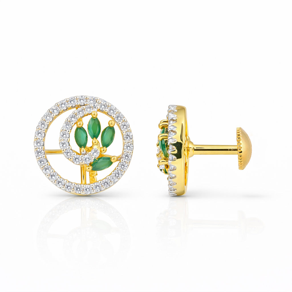 Gold earrings with green gemstones and diamond-like stones on a white background