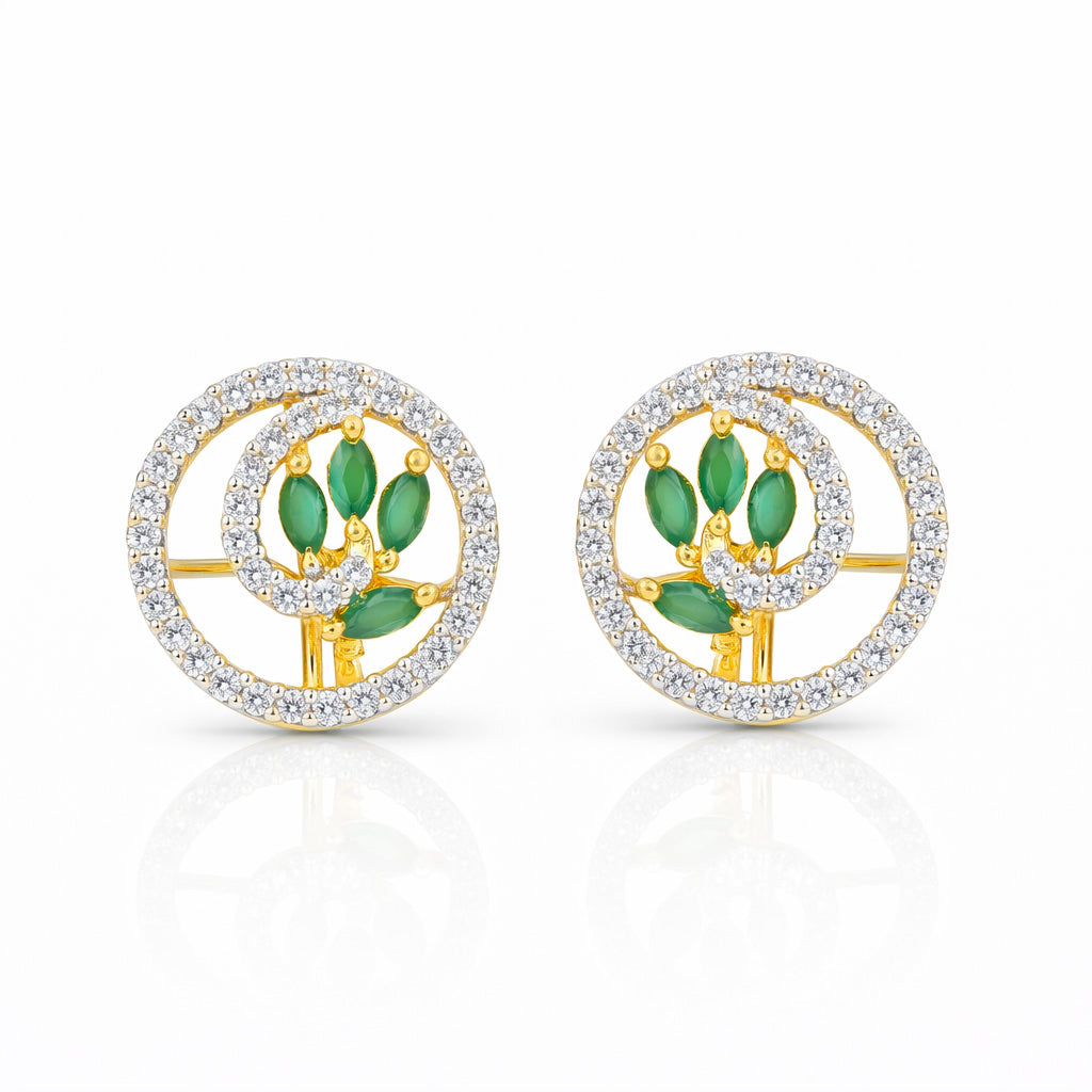 Pair of earrings with green gemstones and gold accents on a white background