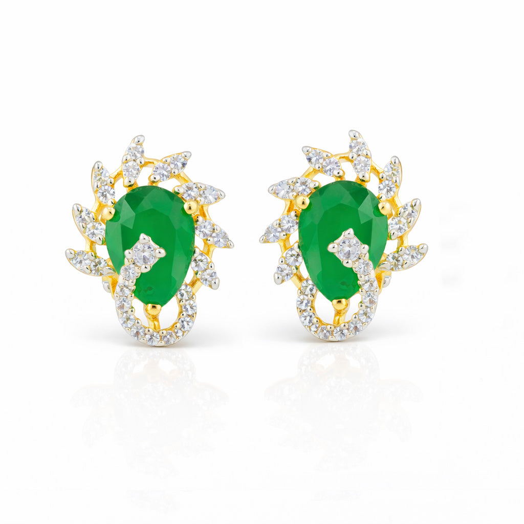 Gold earrings with green gemstones on a white background