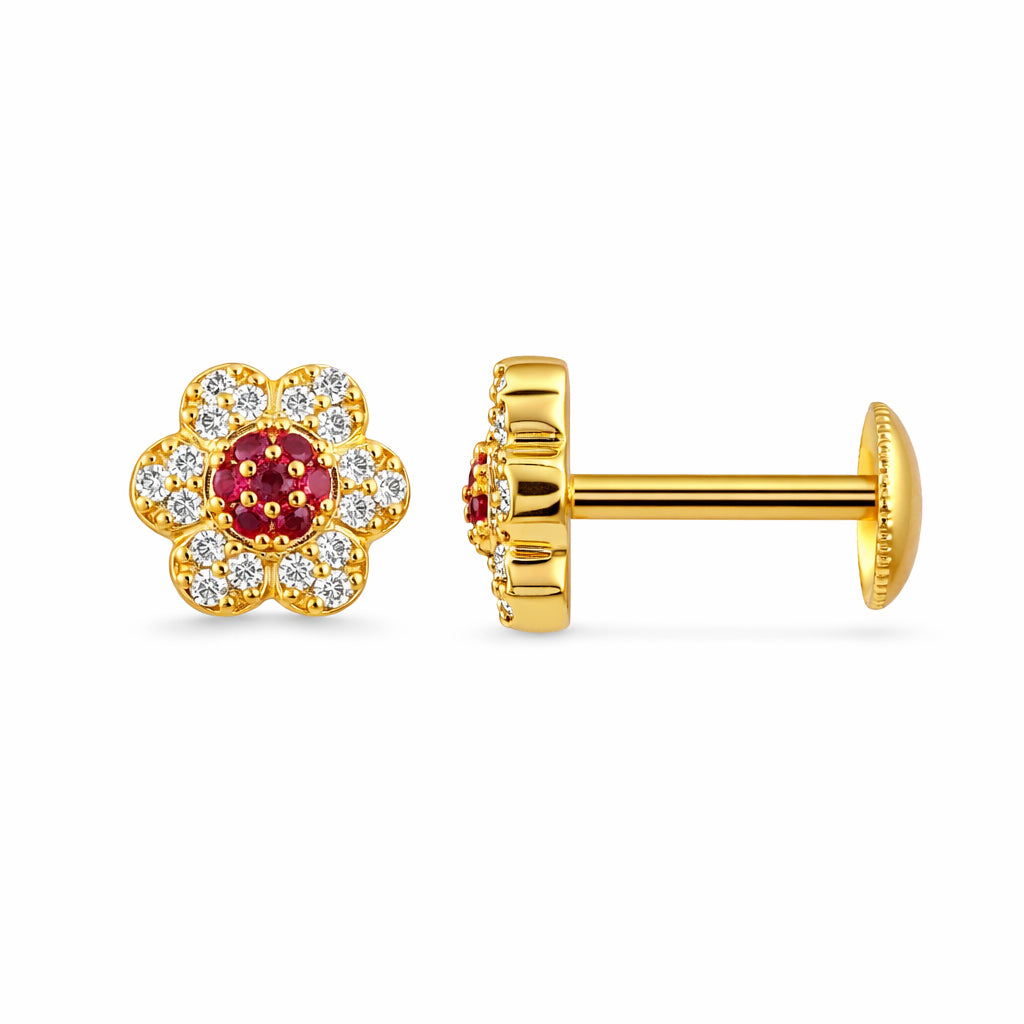Gold earrings with red gemstones and clear stones on a white background