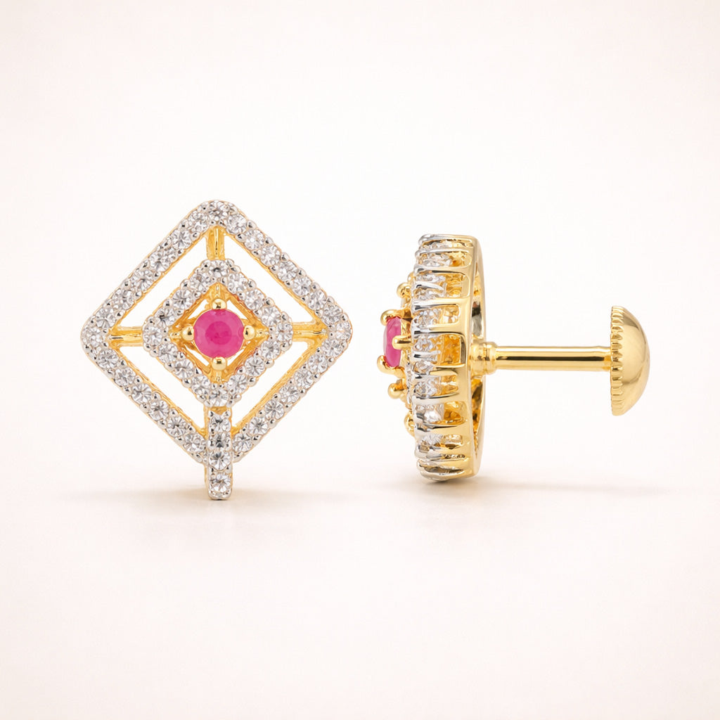Gold earrings with pink gemstones on a white background