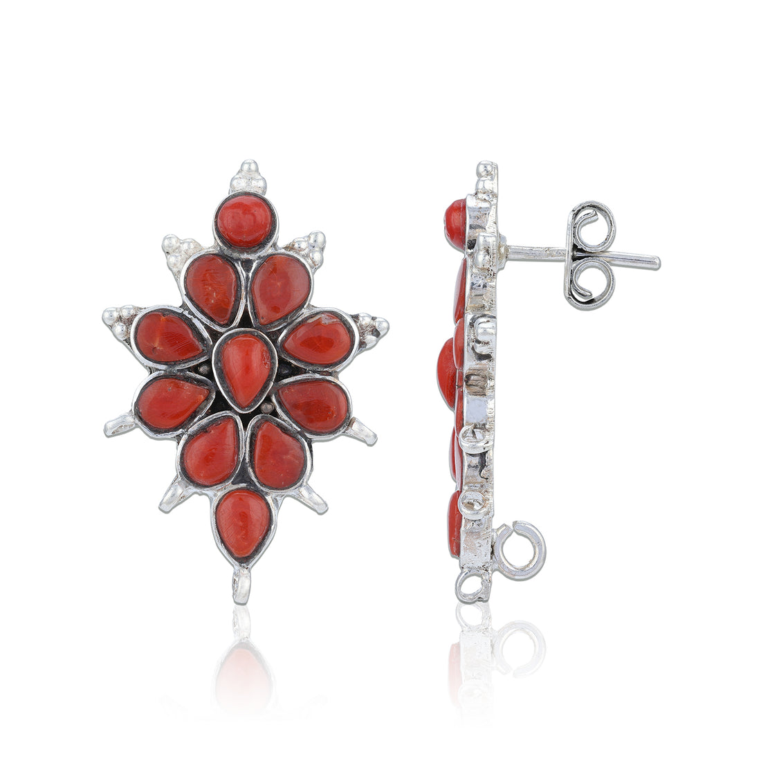 Coral and silver earring on a white background