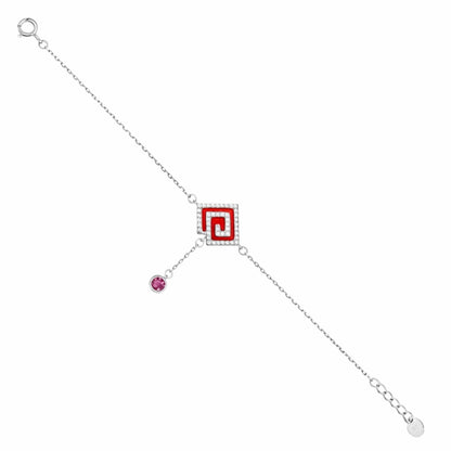 Silver bracelet with a red and white square charm and a pink gemstone on a white background