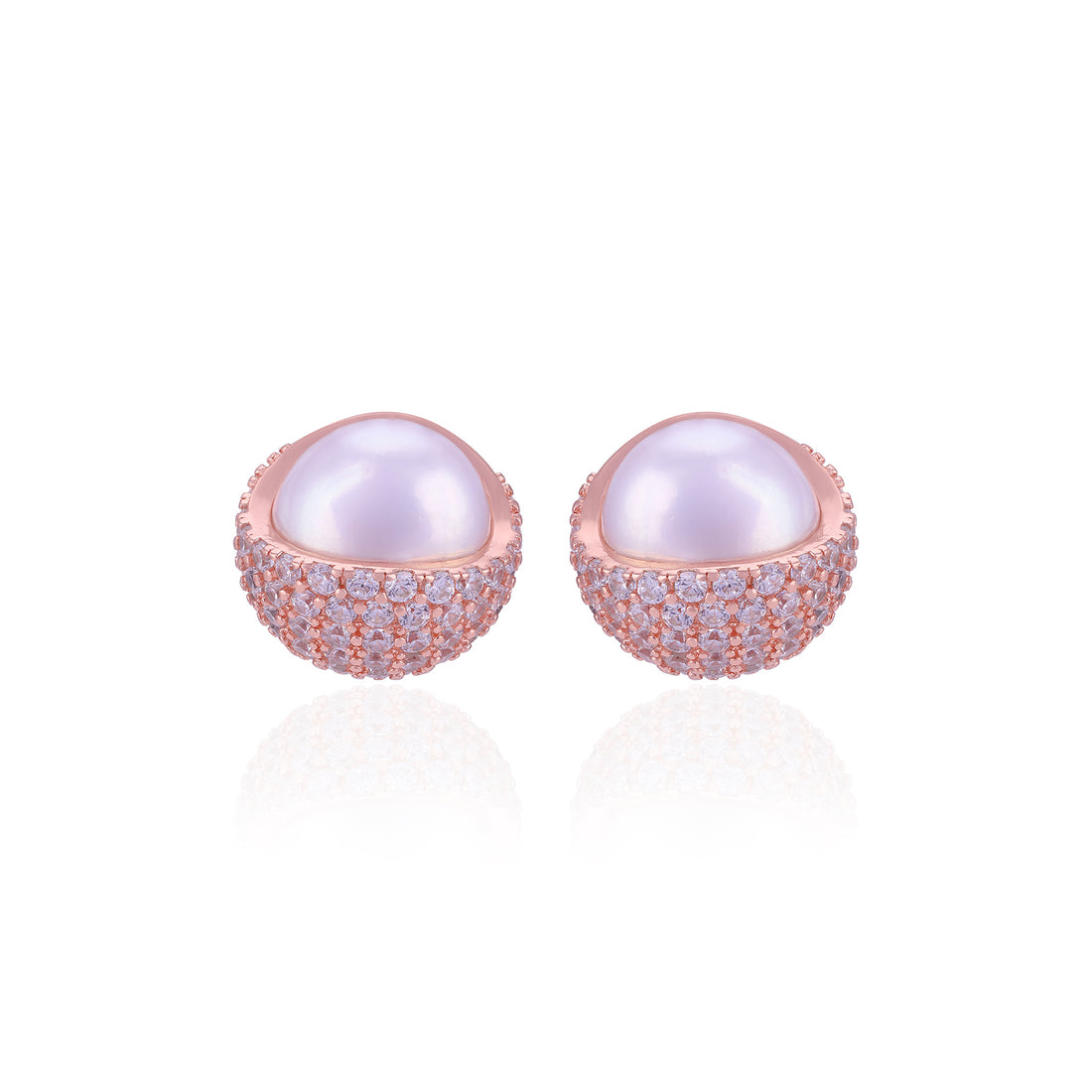Pair of pearl earrings with rose gold and clear gemstone accents on a white background