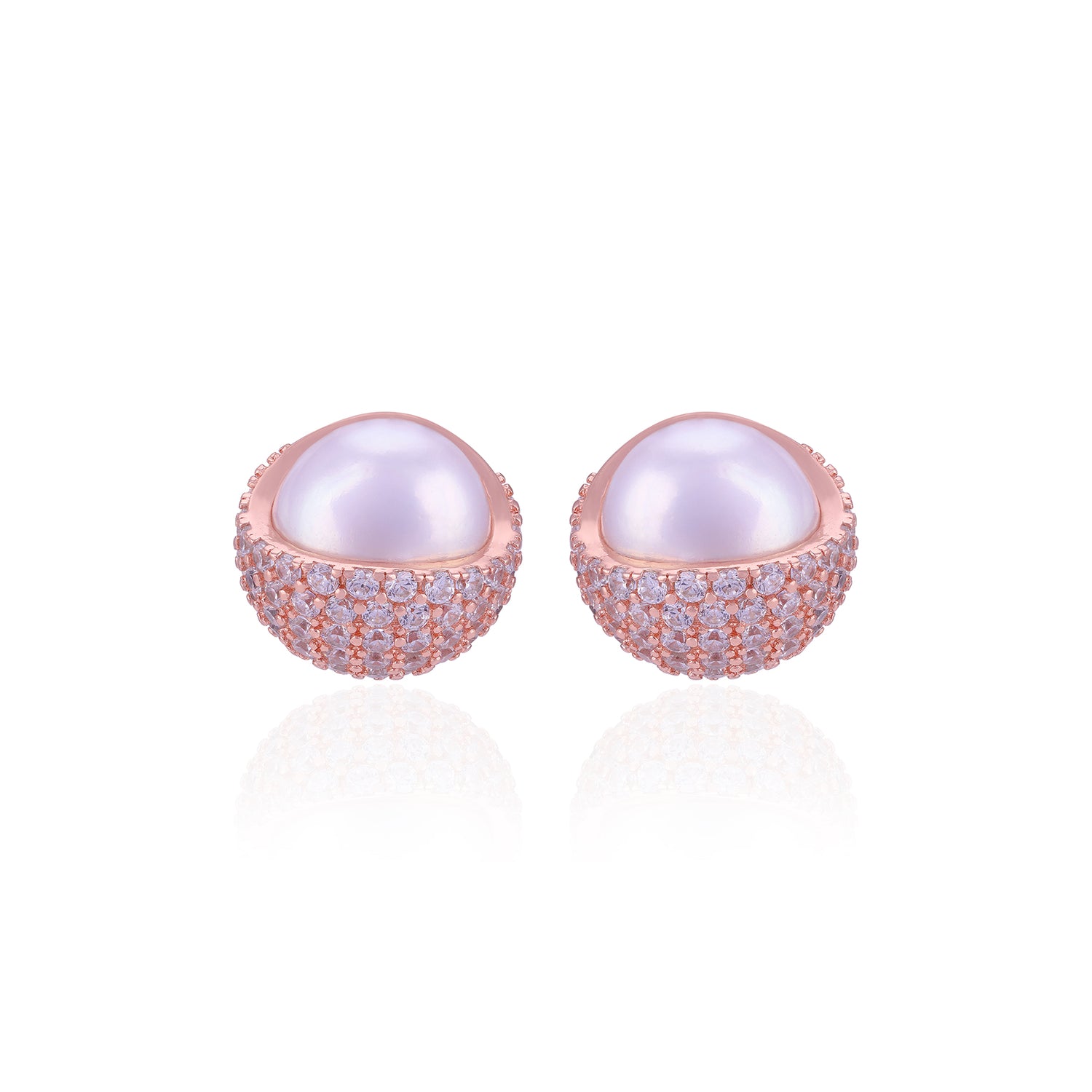 Pair of pearl earrings with rose gold and clear gemstone accents on a white background