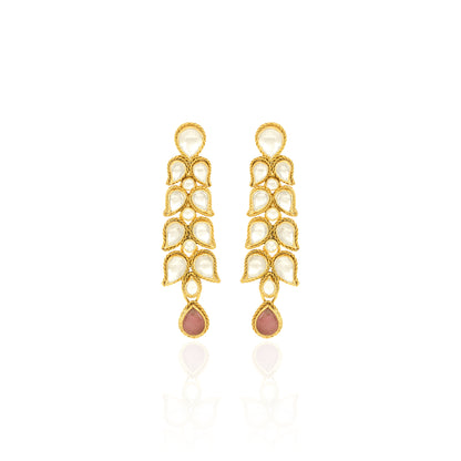 Gold earrings with pearl-like stones on a white background