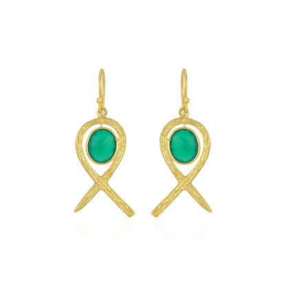 Gold earrings with green stones on a white background