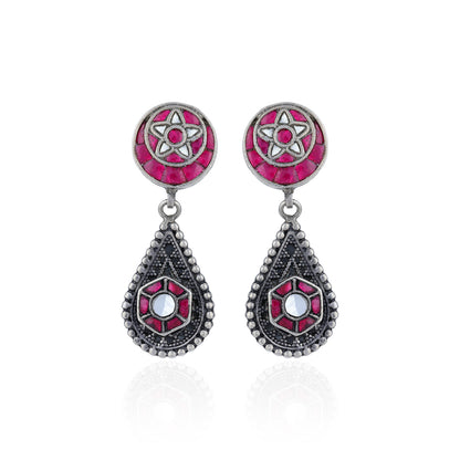 Pair of earrings with pink and silver designs on a white background