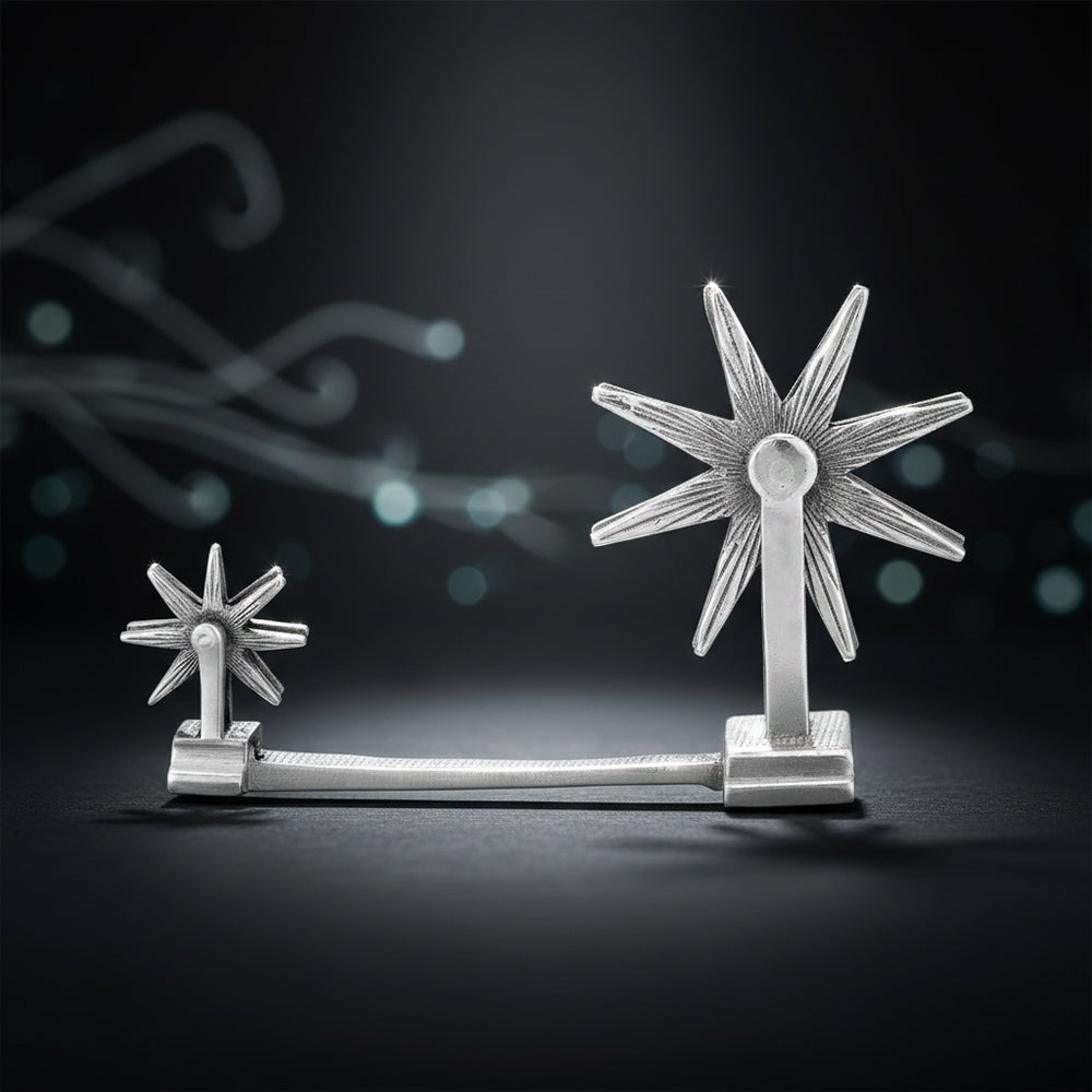 Silver star-shaped object on a dark background