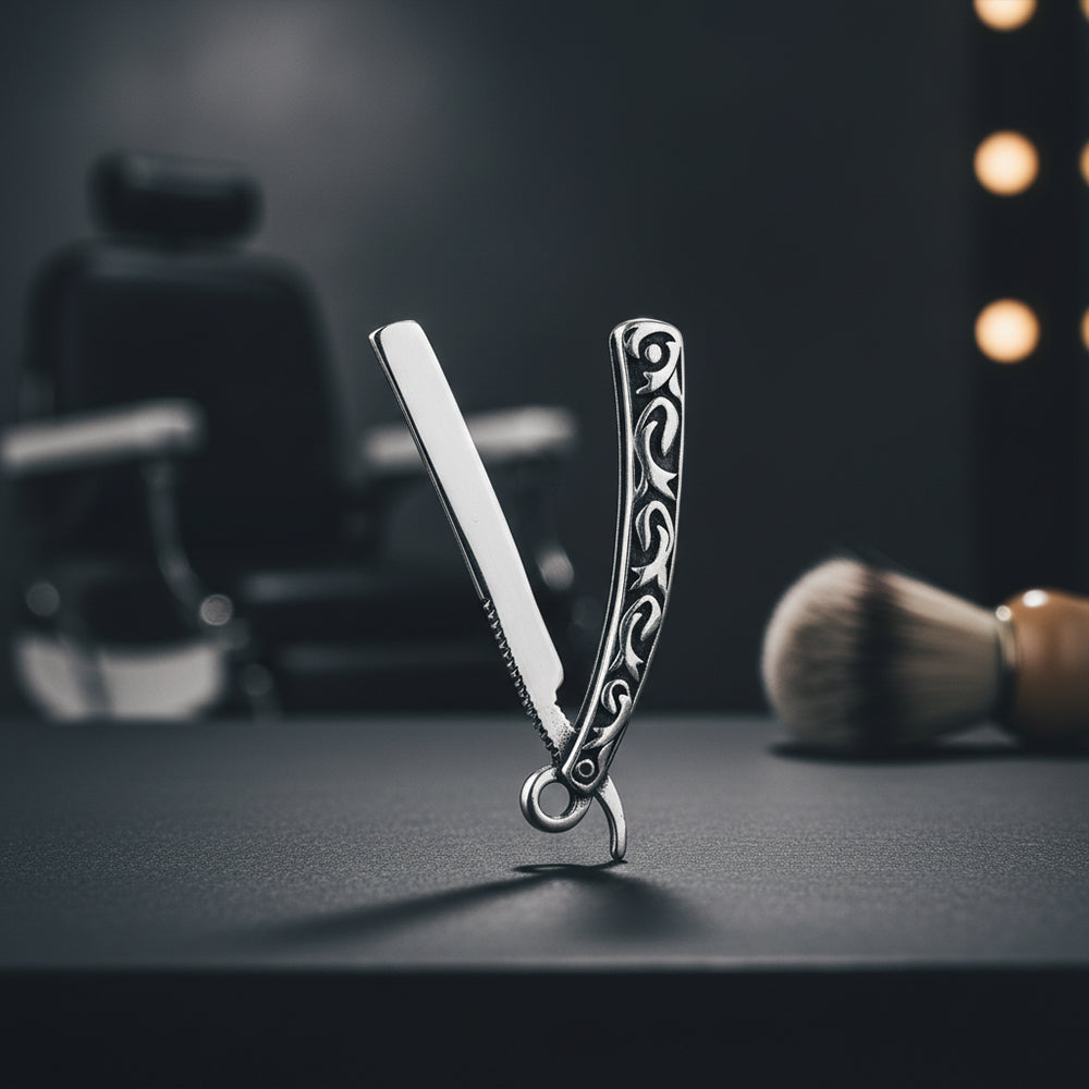 Decorative straight razor on a dark surface with blurred background