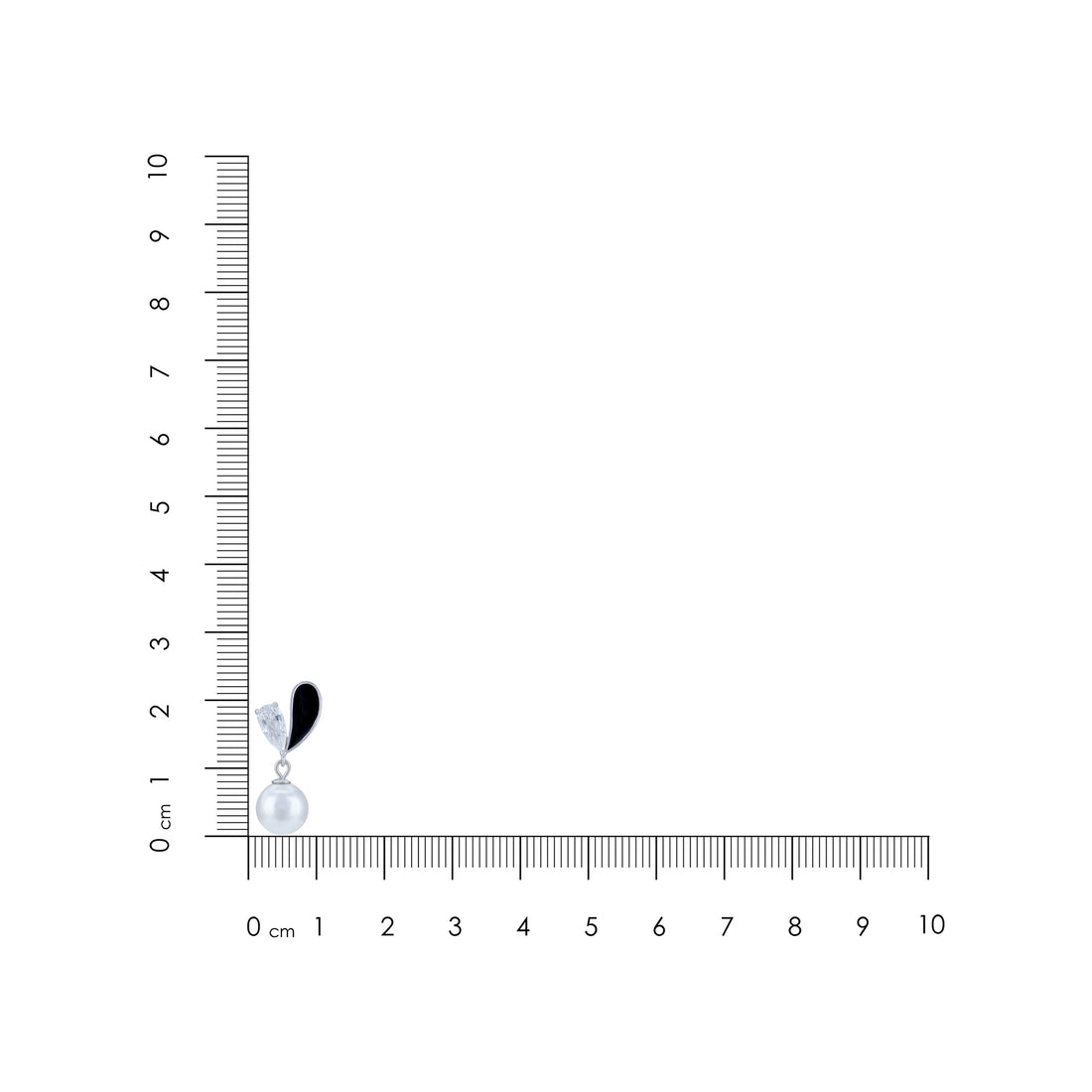 Black and white feathered earring on a ruler for scale