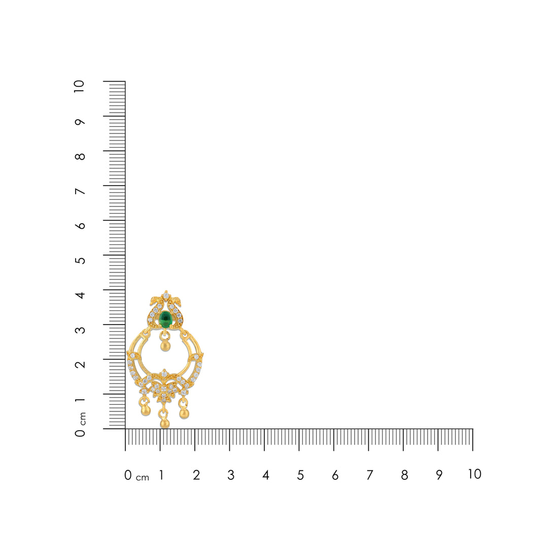 Gold earring with green gemstone next to a ruler on a white background