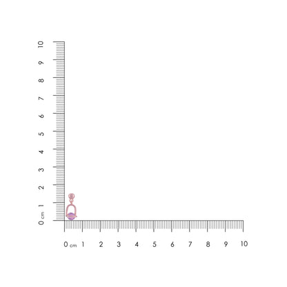 Pink earring on a ruler for scale