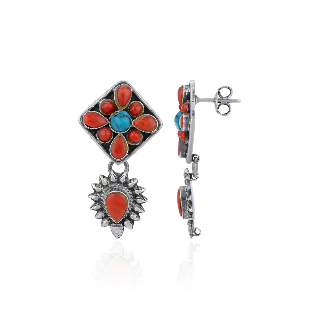 Silver earrings with red and blue stones on a white background