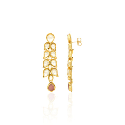 Gold earrings with a central pink gemstone on a white background