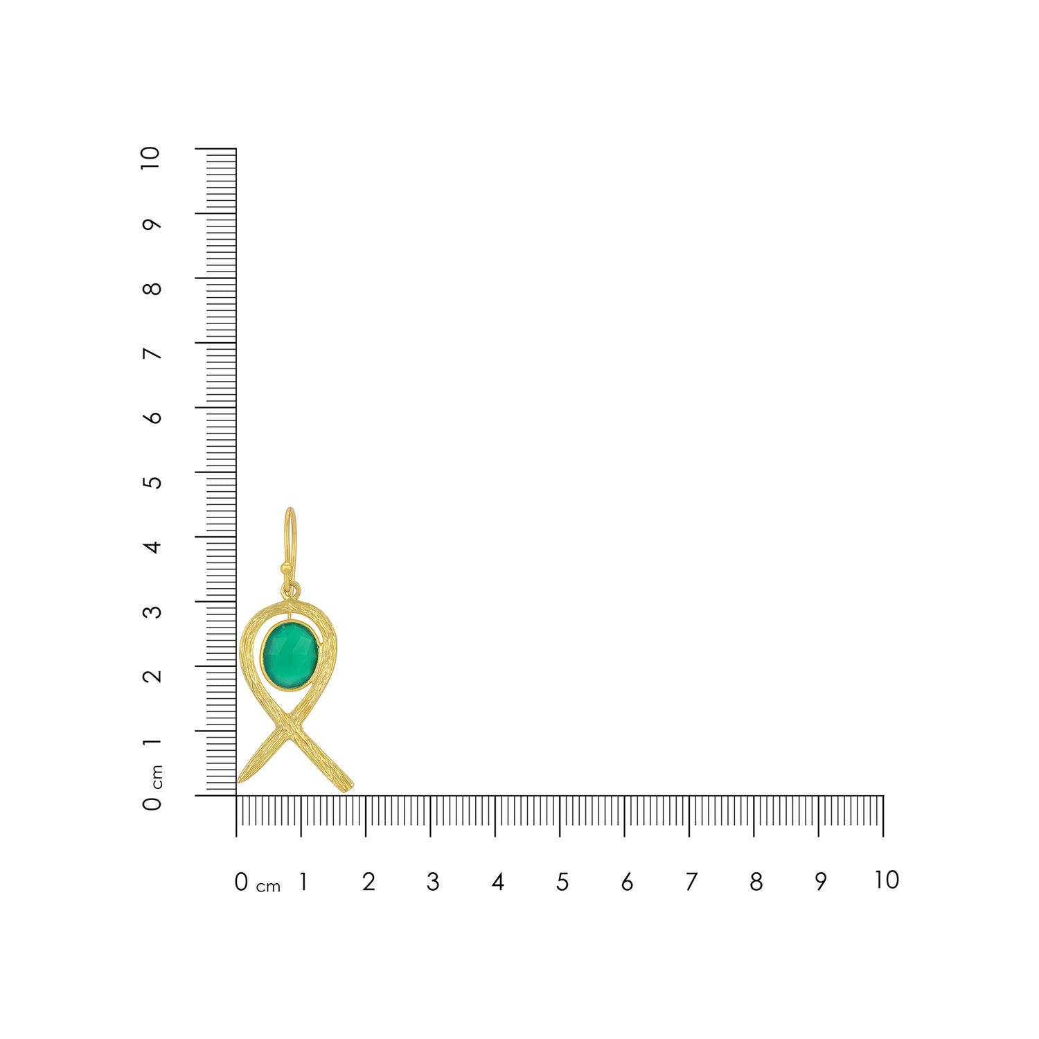 Gold pendant with green gemstone on a ruler for scale