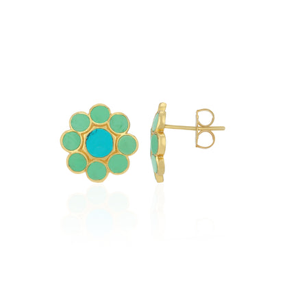 Gold and turquoise flower-shaped earrings on a white background