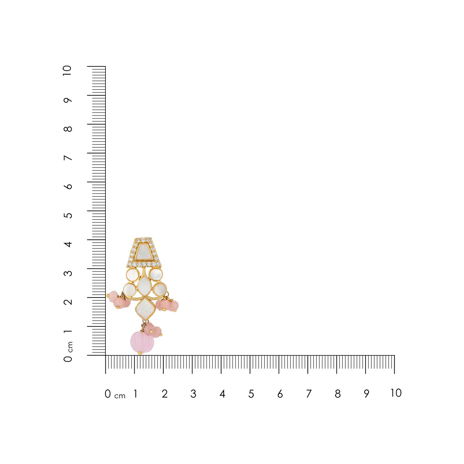 Jewelry charm with pink stones and gold accents next to a ruler for scale on a white background
