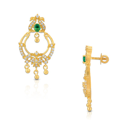 Gold earrings with green gemstones on a white background