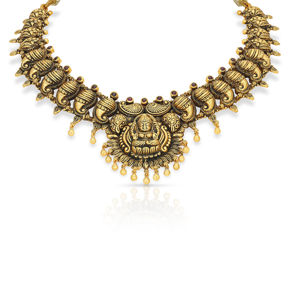Gold necklace with intricate design on a white background