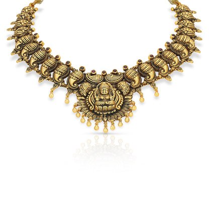 Gold necklace with intricate design on a white background