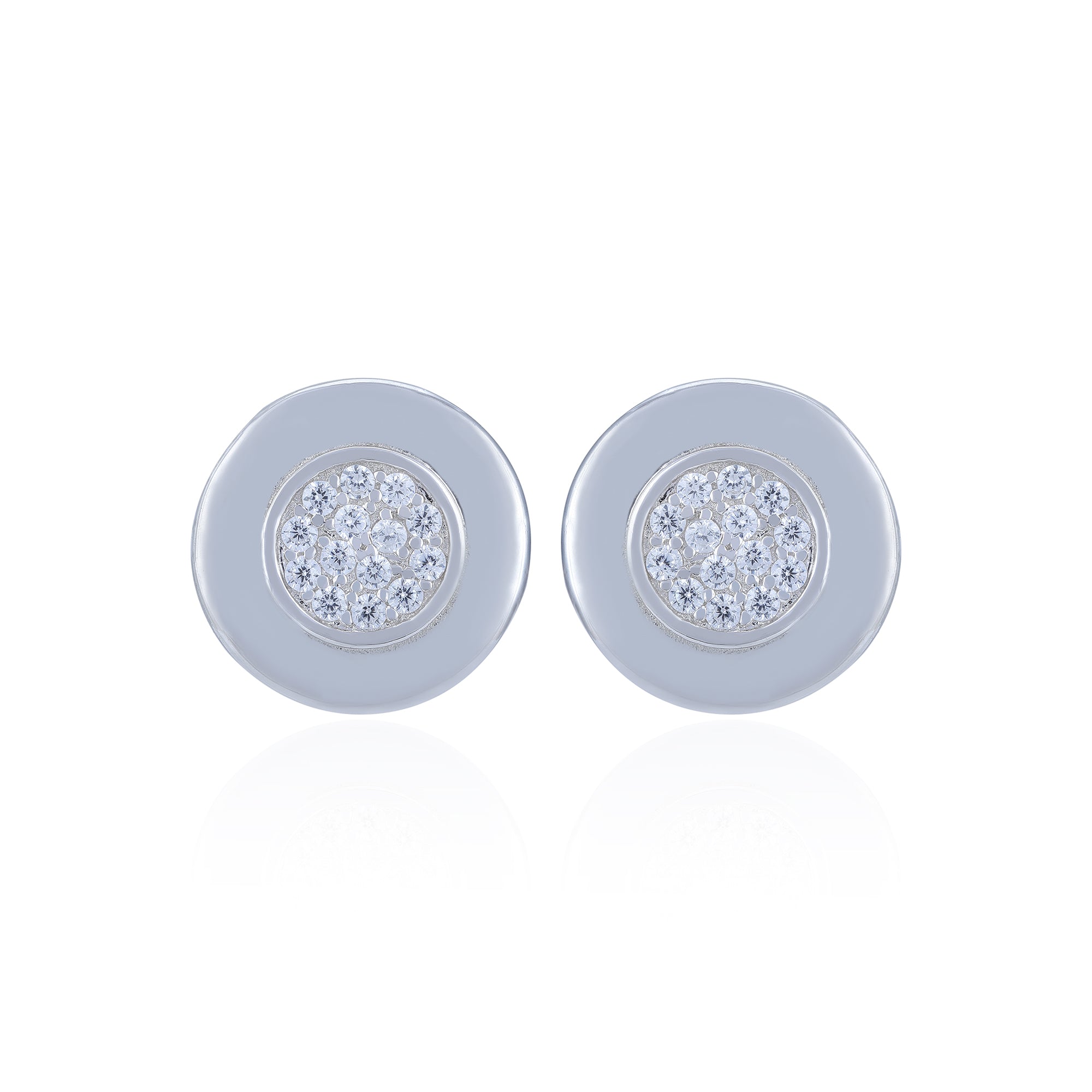 Pair of round earrings with gemstone centers on a white background