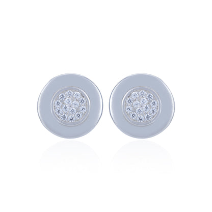 Pair of round earrings with gemstone centers on a white background