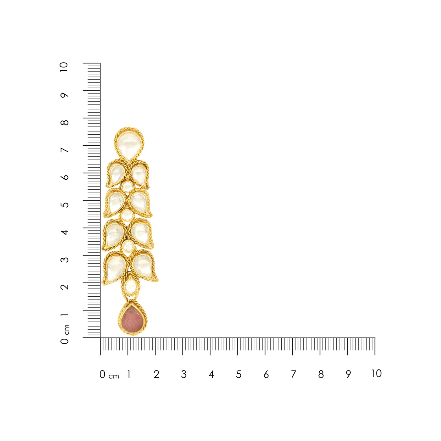 Gold and pearl earring with a ruler for scale on a white background