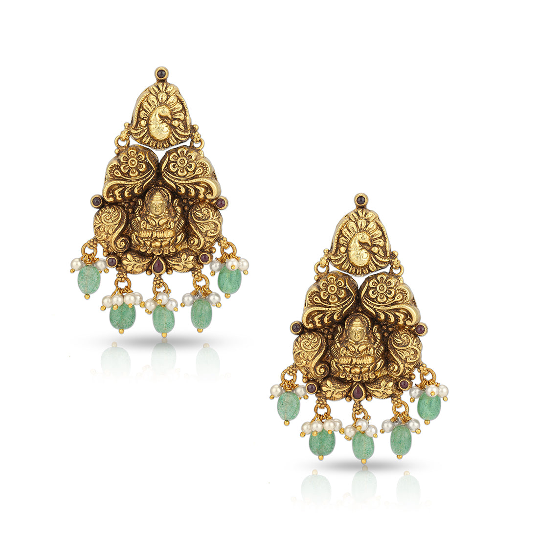 Gold and green earrings on a white background