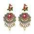 Ornate earrings with red, green, and gold colors on a white background