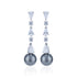 Elegant earrings with pearls and crystals on a white background