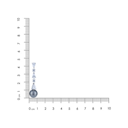 Diamanté earrings with a ruler for scale on a white background
