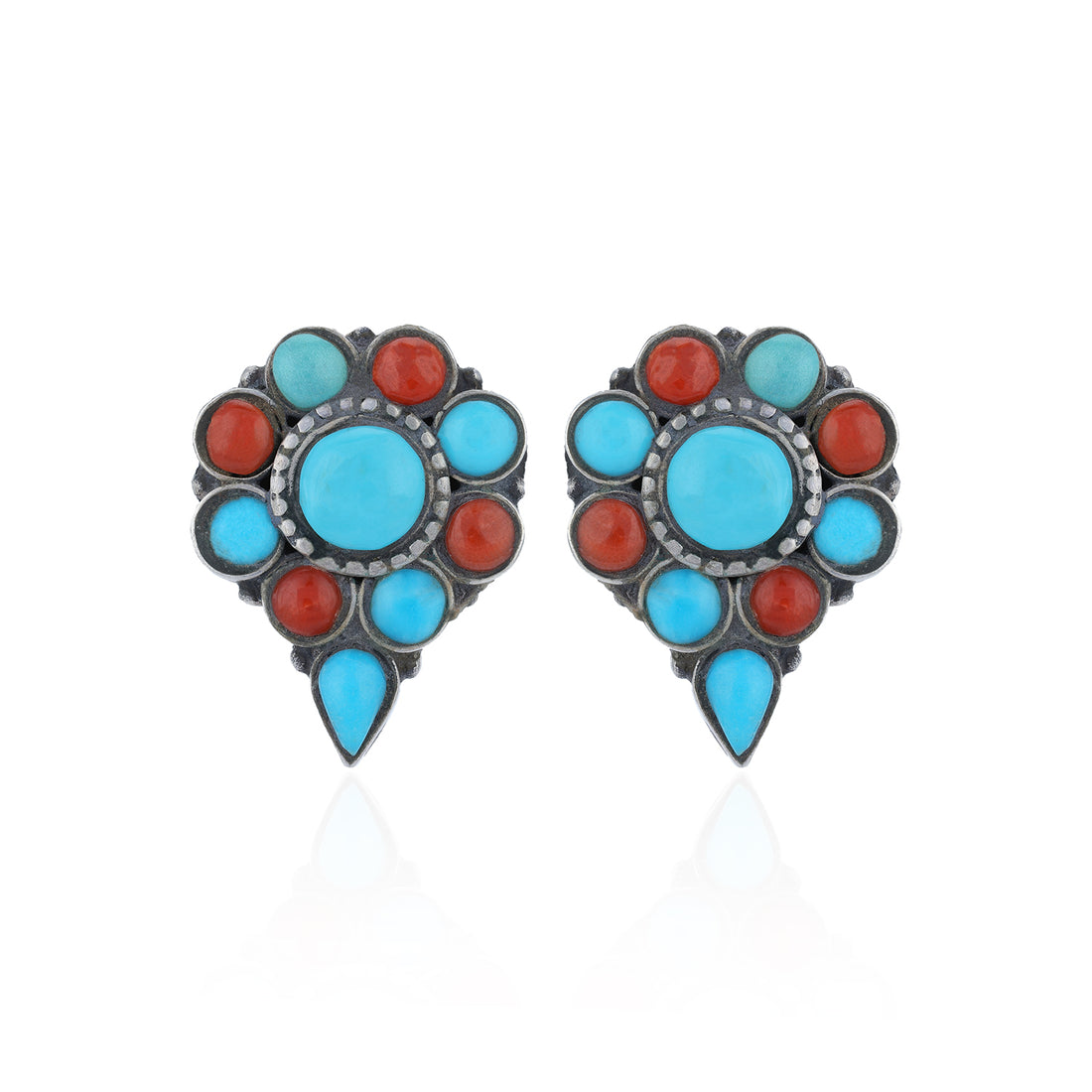 Pair of earrings with turquoise and red stones on a white background